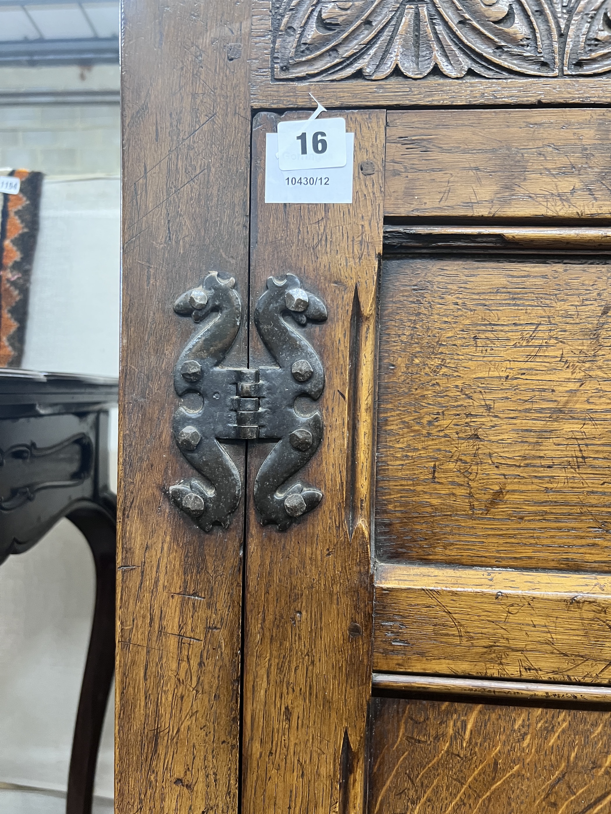 An 18th century style panelled oak hanging cupboard, width 96cm, depth 53cm, height 178cm